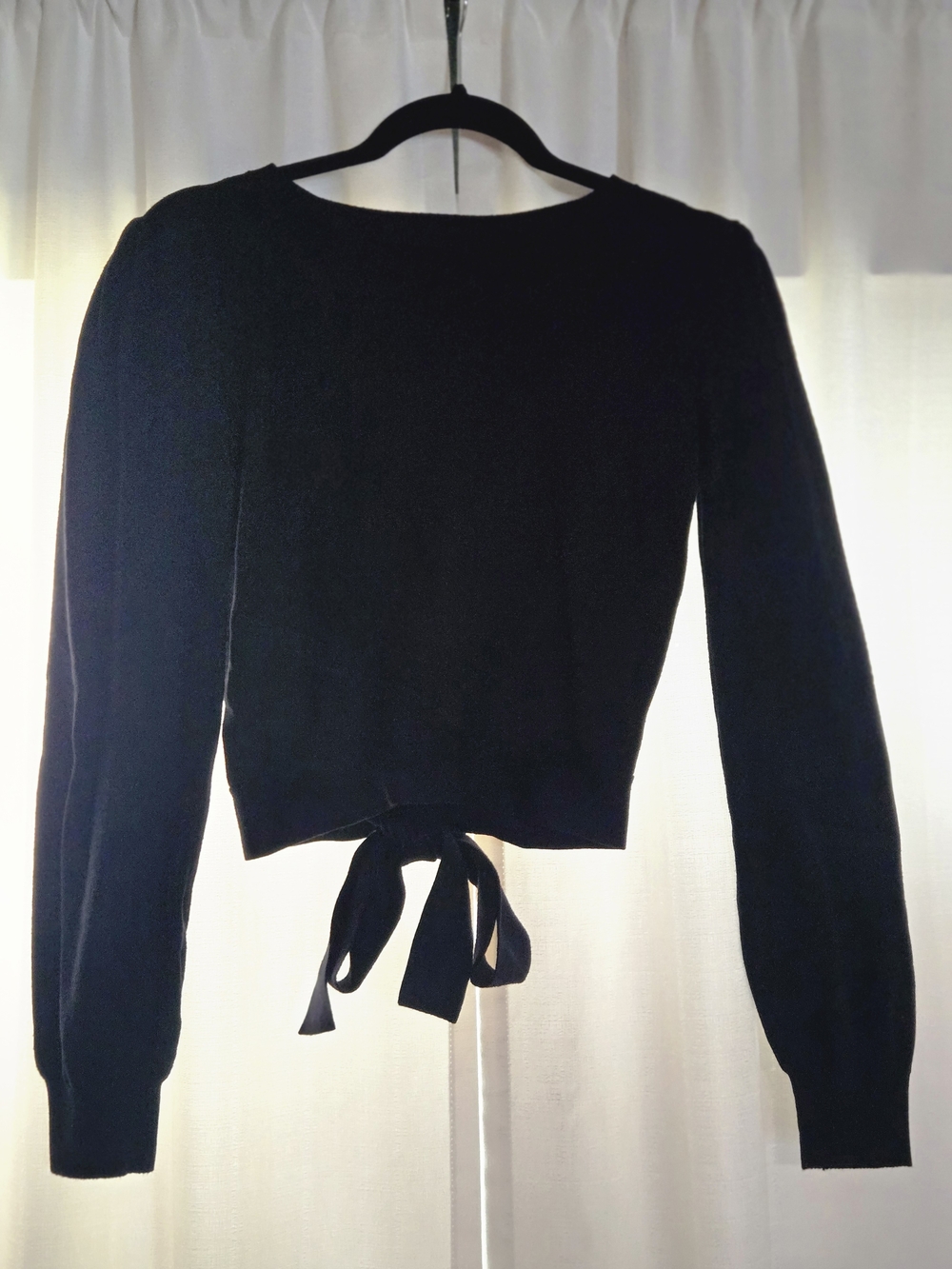Black long sleeve shirt with bow tie closure in the back from francesc's